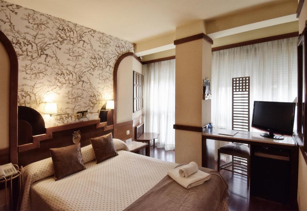 TV a/nebo společenská místnost v ubytování Hotel Maria Luisa