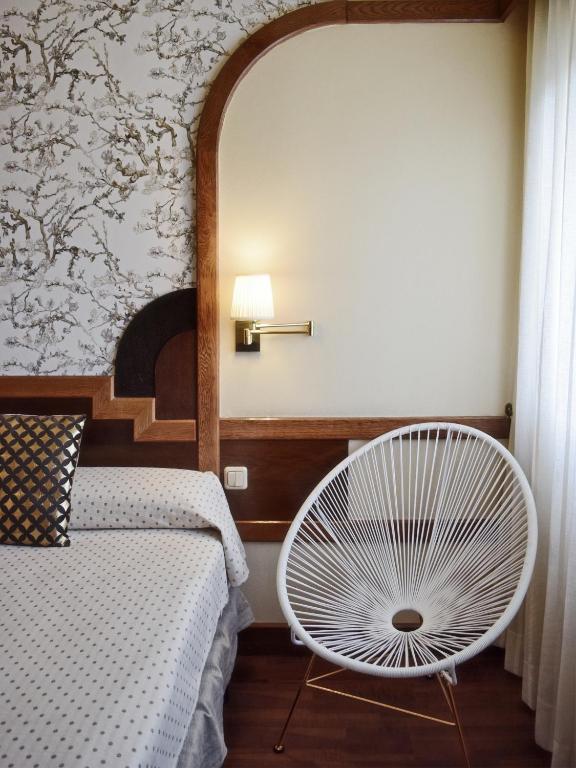 Postel nebo postele na pokoji v ubytování Hotel Maria Luisa