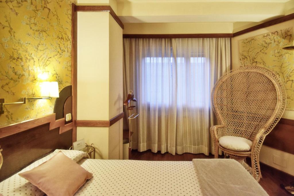 Postel nebo postele na pokoji v ubytování Hotel Maria Luisa