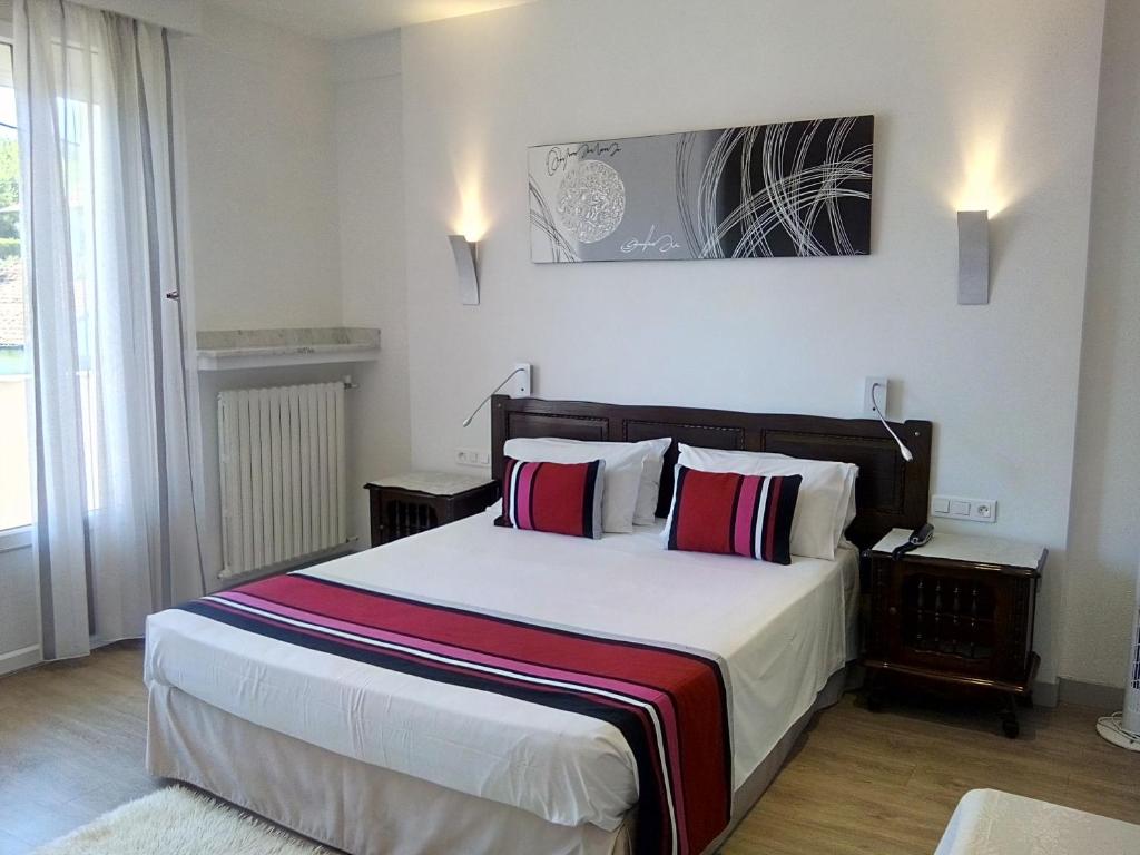 Postel nebo postele na pokoji v ubytování Hotel Uhainak