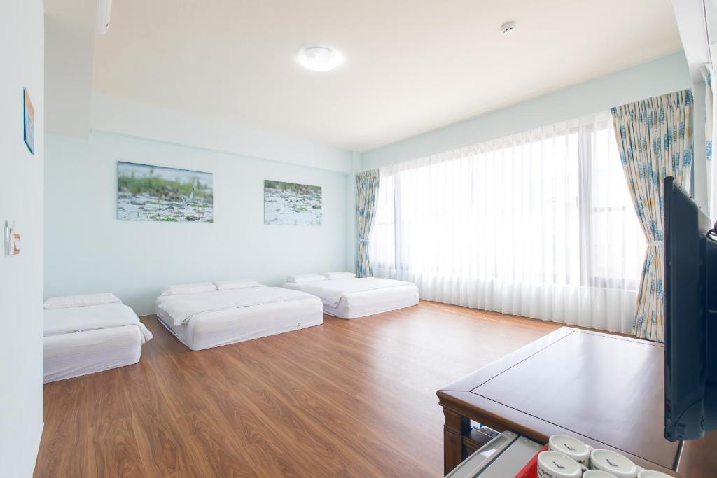 Postel nebo postele na pokoji v ubytování 5+1 Homestay
