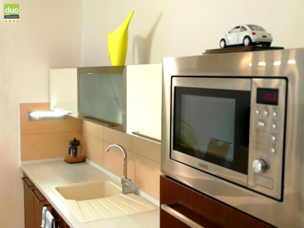 Kuchyň nebo kuchyňský kout v ubytování Apartmány Duo