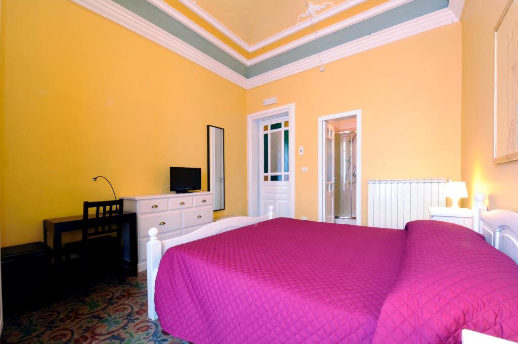 A bed or beds in a room at B&B Porta della Terra