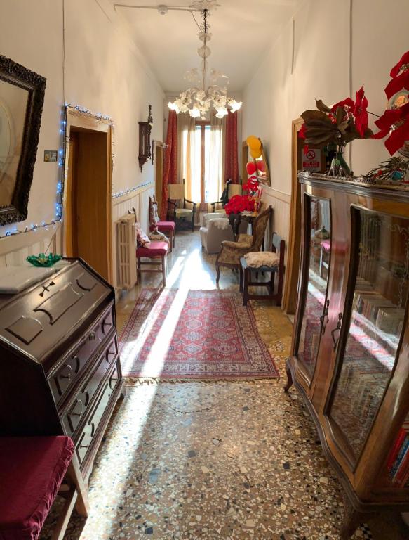 a room with a living room with a living room at Princess Guest House Canal View in Venice