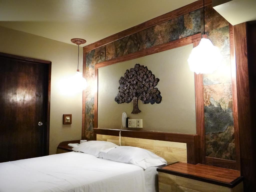 Postel nebo postele na pokoji v ubytování Silmar Hotel/Motel