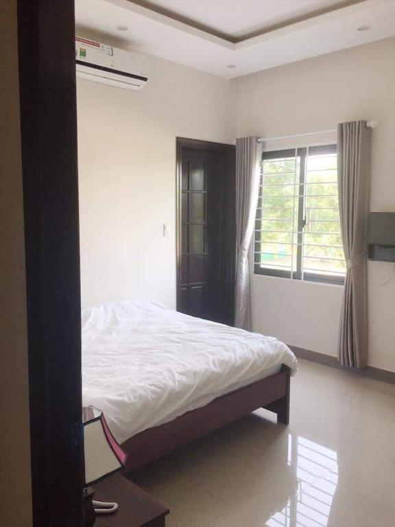 Postel nebo postele na pokoji v ubytování Motel Thanh Long