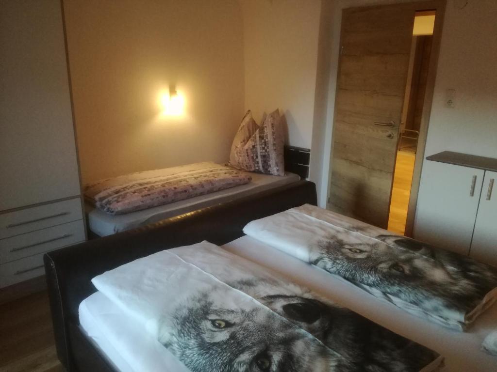 Postel nebo postele na pokoji v ubytování Haus Manfred