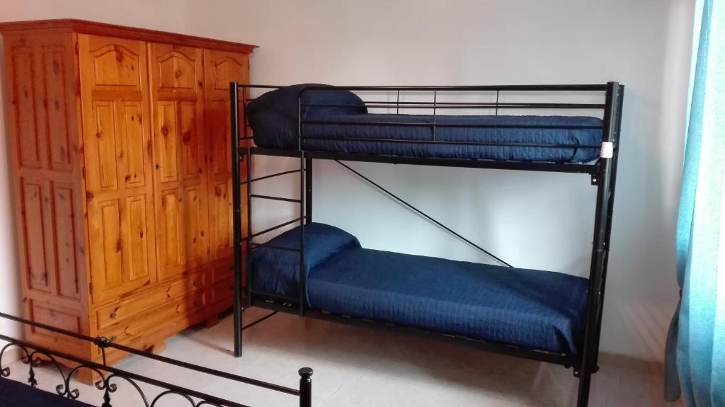 Postel nebo postele na pokoji v ubytování Kali Nitta Salento