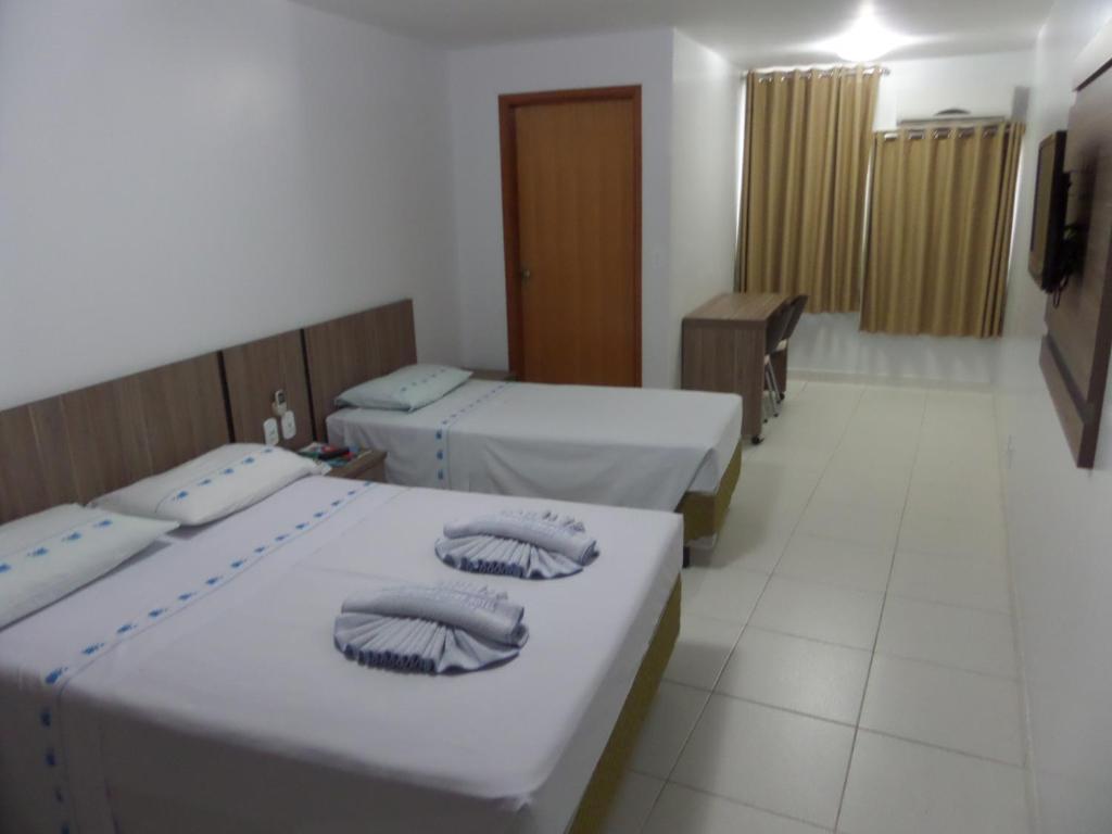 Cama ou camas em um quarto em Hotel CTC