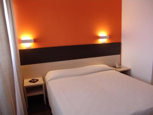 Postel nebo postele na pokoji v ubytování Hotel Milano