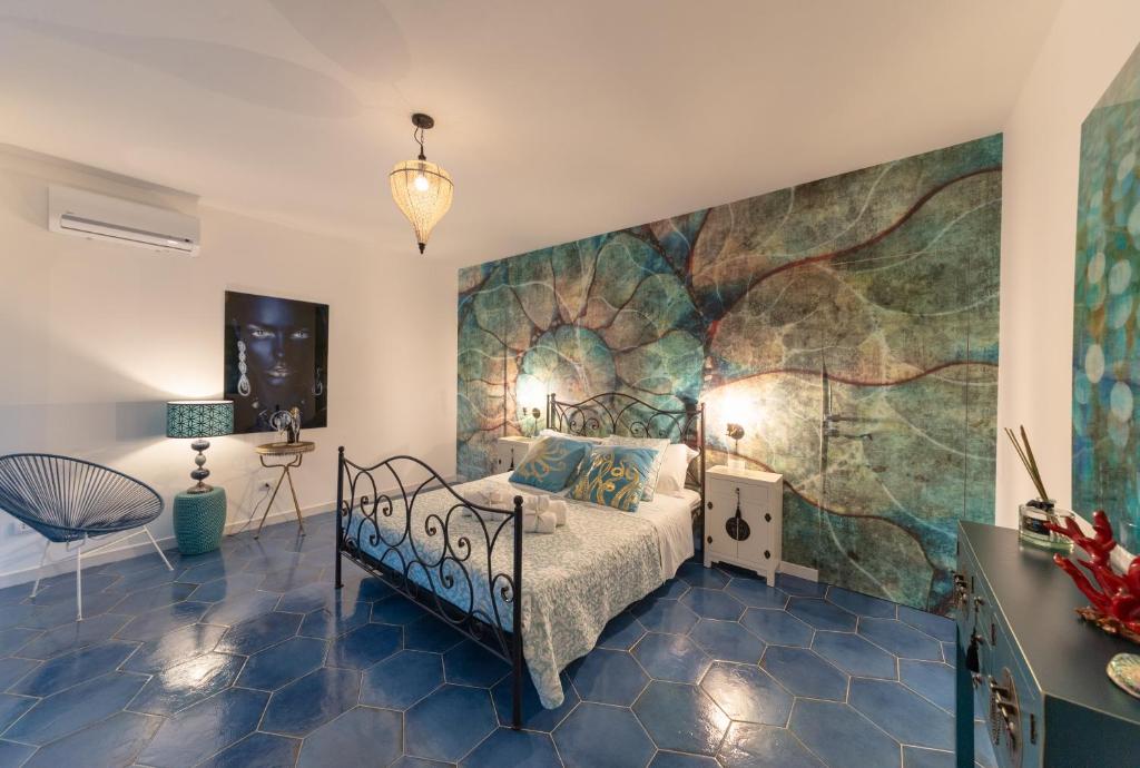 Postel nebo postele na pokoji v ubytování QuattroCuori Boutique Hotel & Spa
