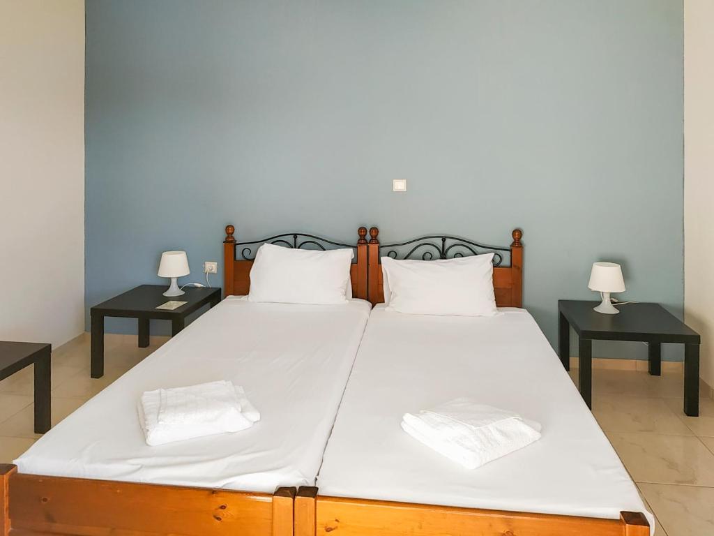 Postel nebo postele na pokoji v ubytování Pasithea apts