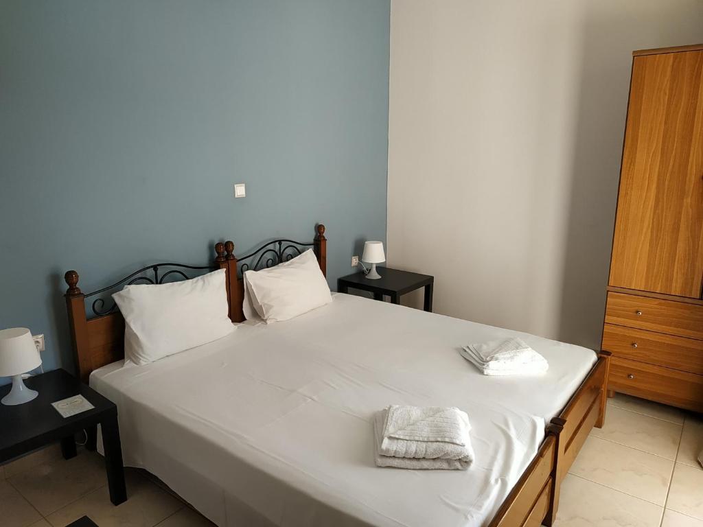 Postel nebo postele na pokoji v ubytování Pasithea apts