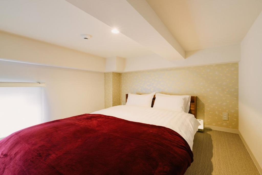 Postel nebo postele na pokoji v ubytování TEN APARTMENT HOTEL