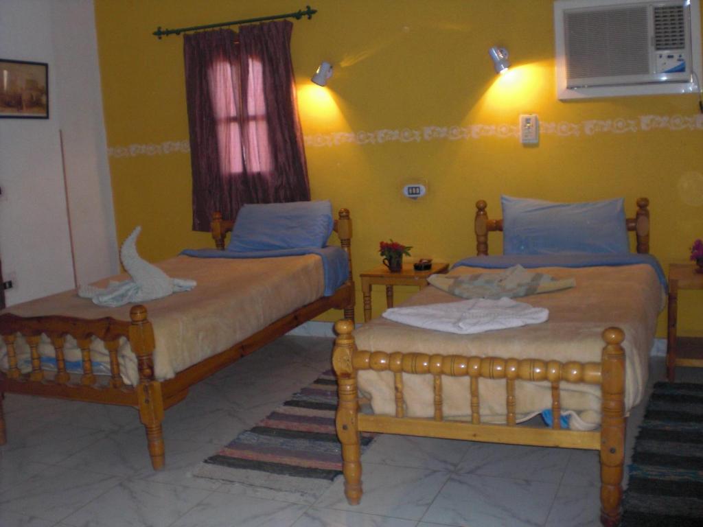 Postel nebo postele na pokoji v ubytování El Fayrouz Hotel
