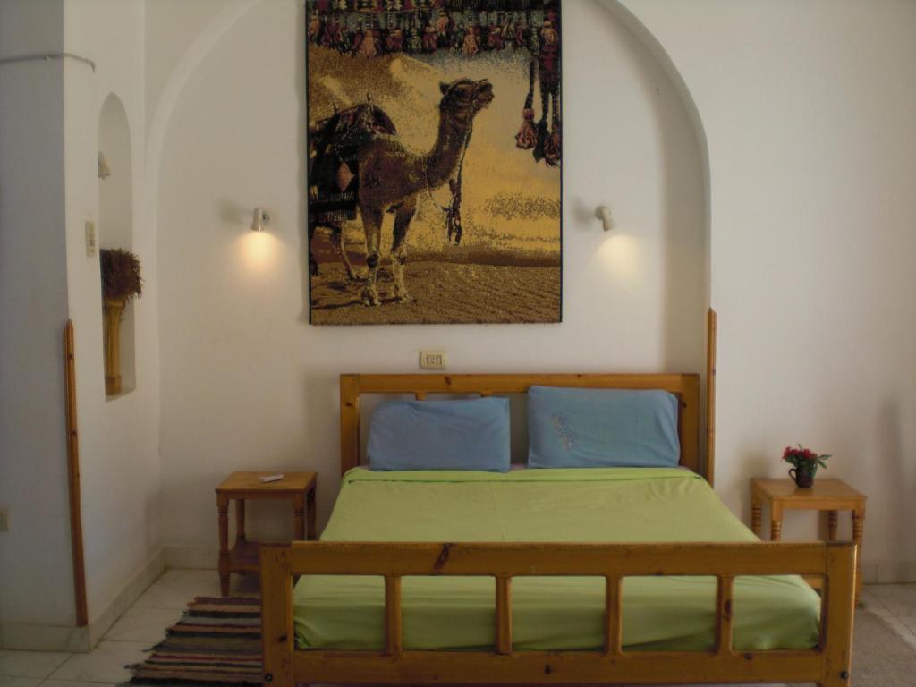 Postel nebo postele na pokoji v ubytování El Fayrouz Hotel