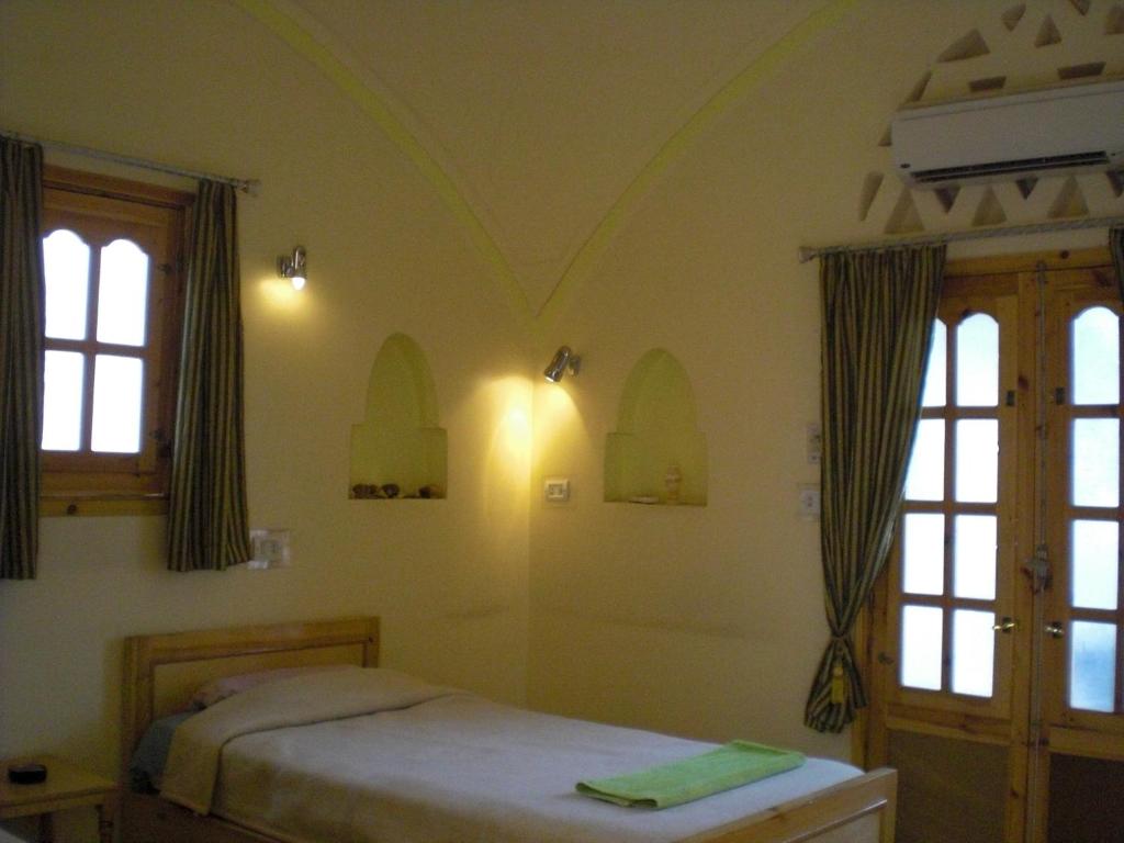 Postel nebo postele na pokoji v ubytování El Fayrouz Hotel