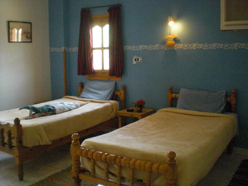 Postel nebo postele na pokoji v ubytování El Fayrouz Hotel