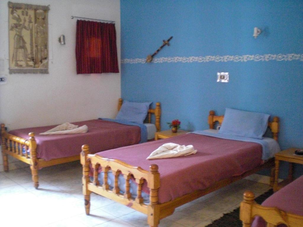 Postel nebo postele na pokoji v ubytování El Fayrouz Hotel
