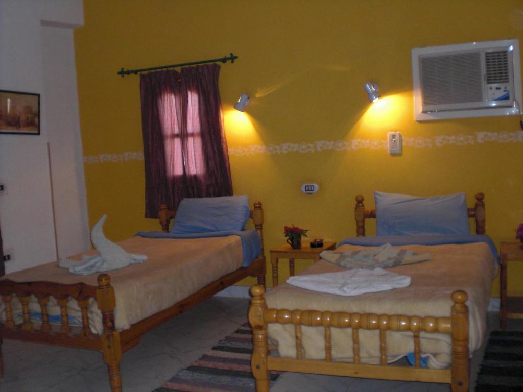 Postel nebo postele na pokoji v ubytování El Fayrouz Hotel