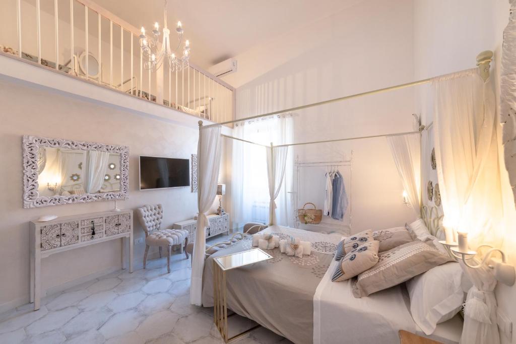 TV a/nebo společenská místnost v ubytování QuattroCuori Boutique Hotel & Spa