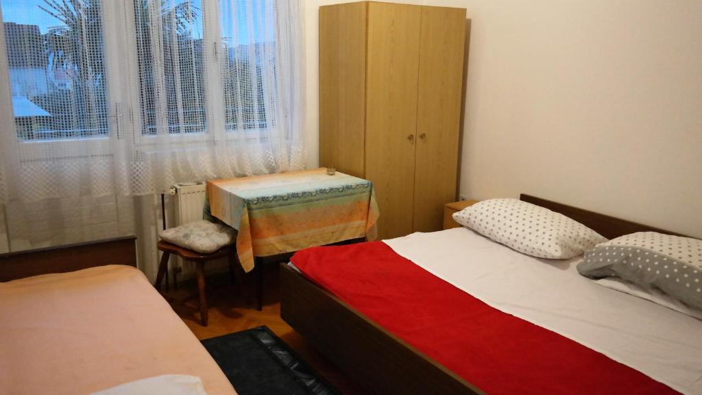 Postel nebo postele na pokoji v ubytování Apartmani Zorica