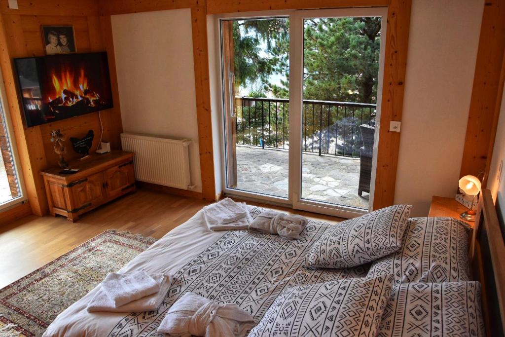 Postel nebo postele na pokoji v ubytování Chalet Belmont