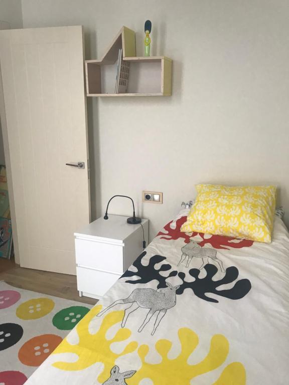 Łóżko lub łóżka w pokoju w obiekcie Preciosa Casa en el Casco Histórico de Baiona