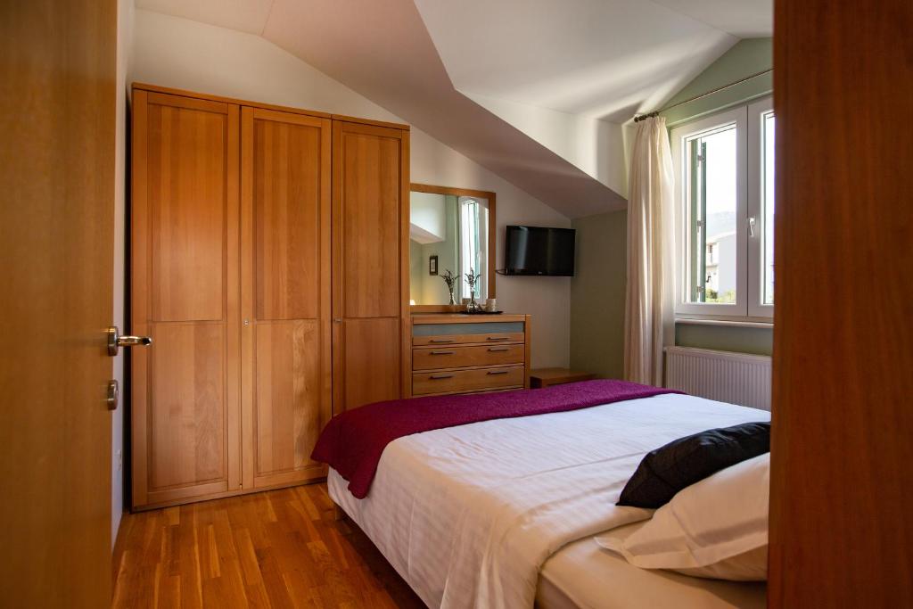 Postel nebo postele na pokoji v ubytování Villa Mendula