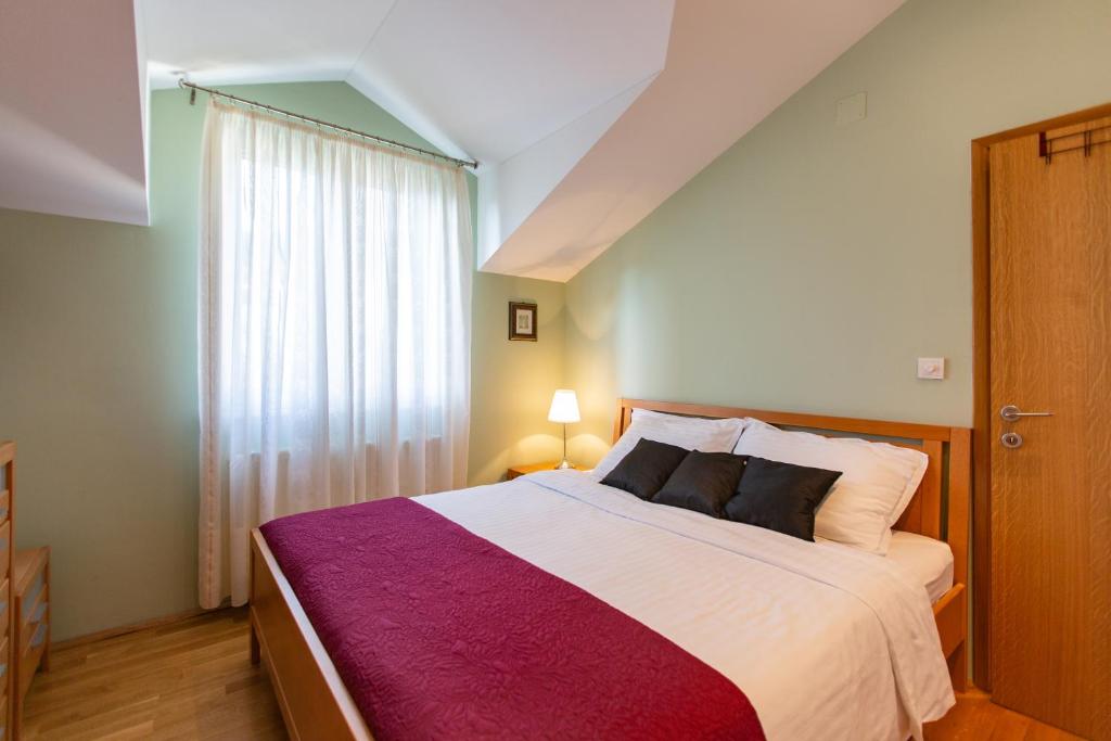 Postel nebo postele na pokoji v ubytování Villa Mendula