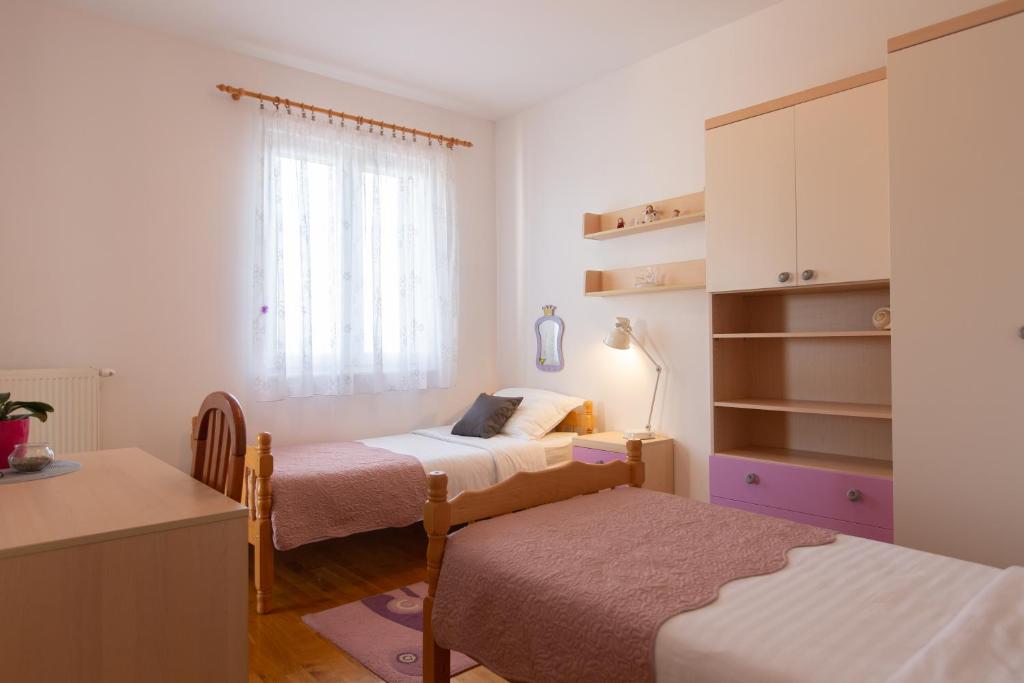 Postel nebo postele na pokoji v ubytování Villa Mendula