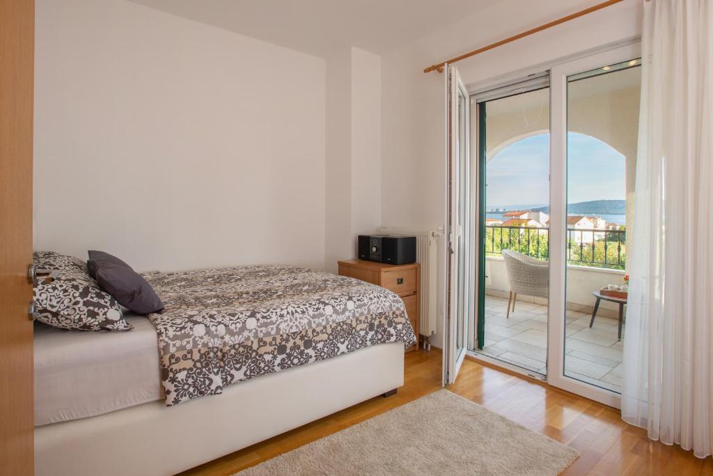 Postel nebo postele na pokoji v ubytování Villa Mendula