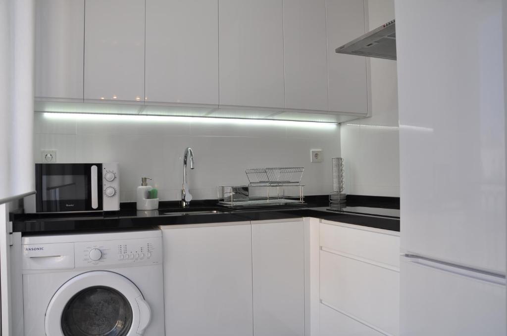 Kuchyň nebo kuchyňský kout v ubytování Apartamentos Alfonso XIII