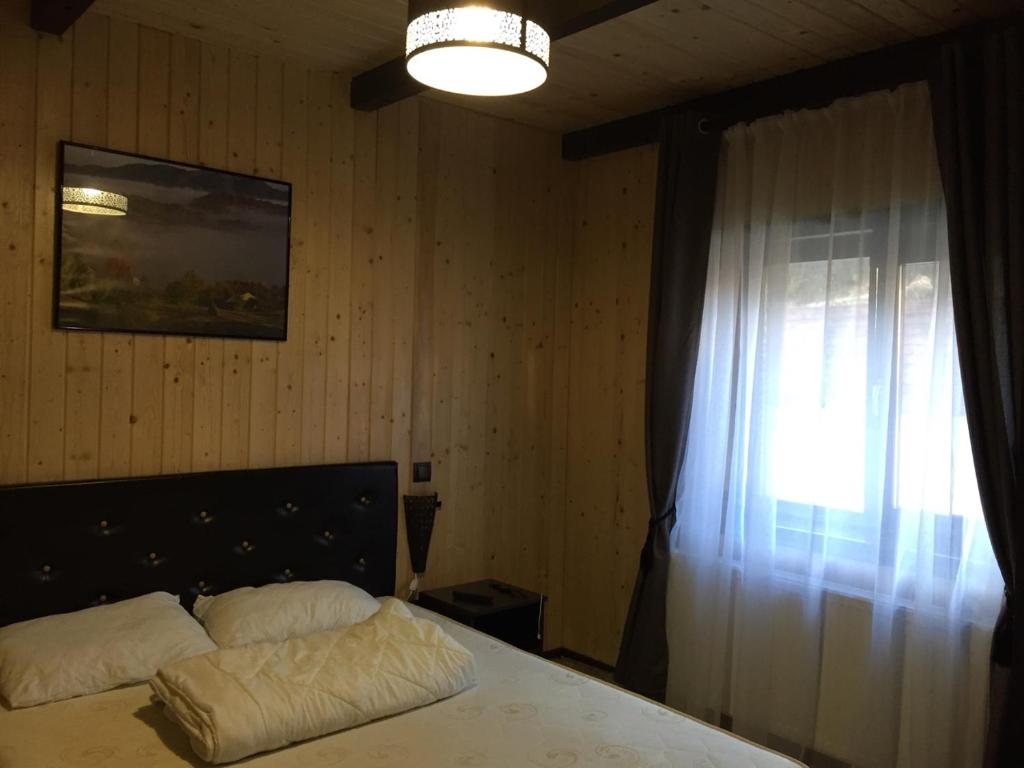 Postel nebo postele na pokoji v ubytování Licurici