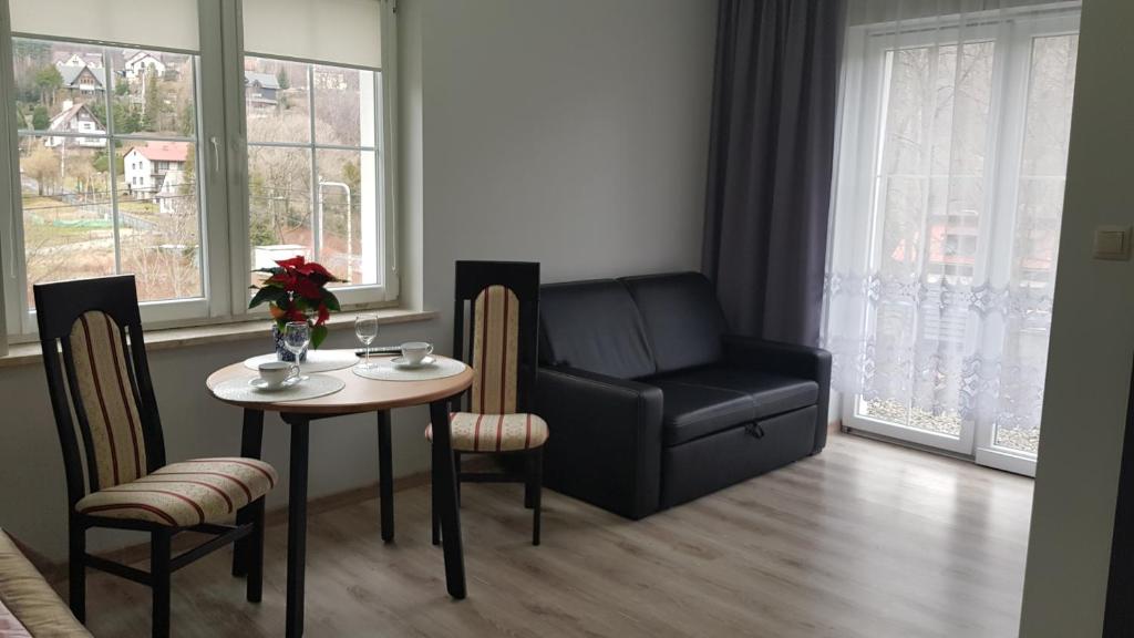 Posezení v ubytování Apartamenty pod Czyrną