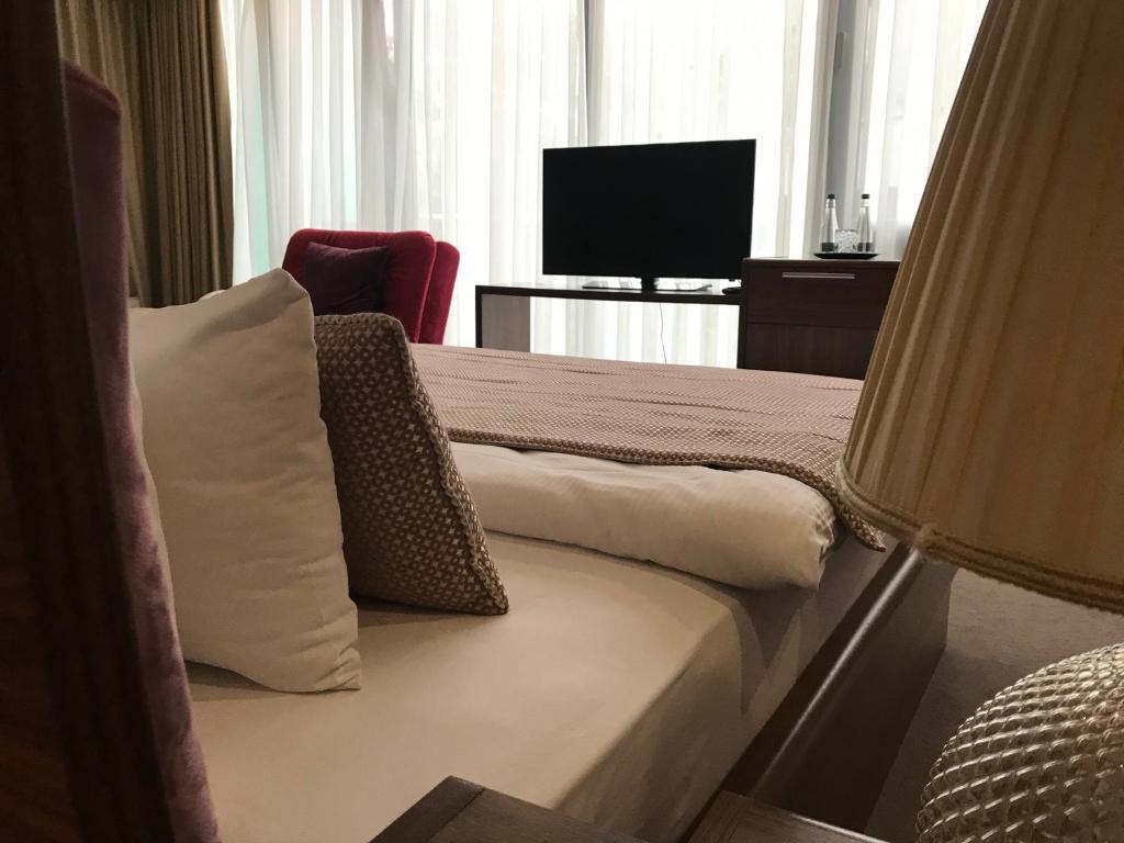 TV a/nebo společenská místnost v ubytování Hotel Royal Gold City