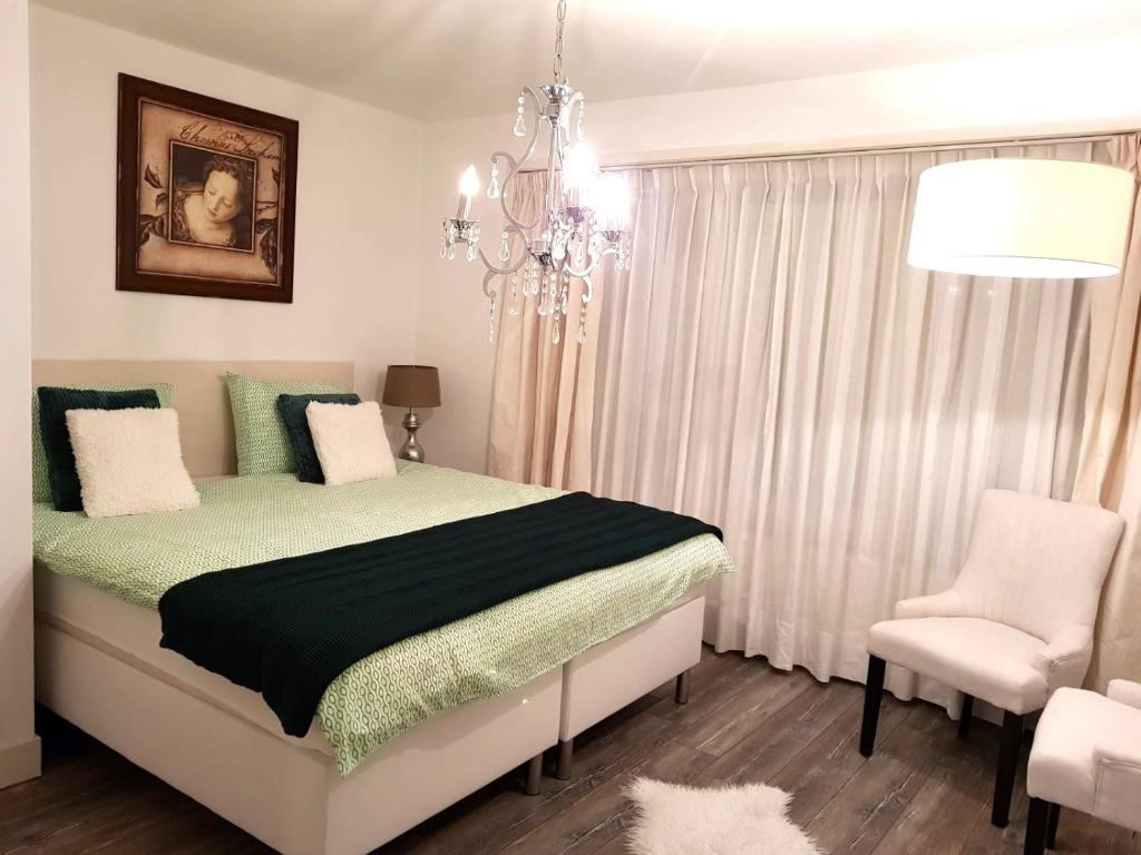 Un pat sau paturi într-o cameră la Beijerse inn