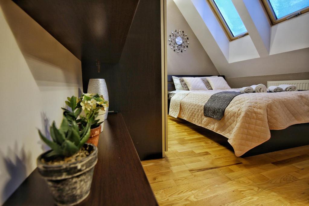 Posteľ alebo postele v izbe v ubytovaní Zakopane Apartamenty LUX