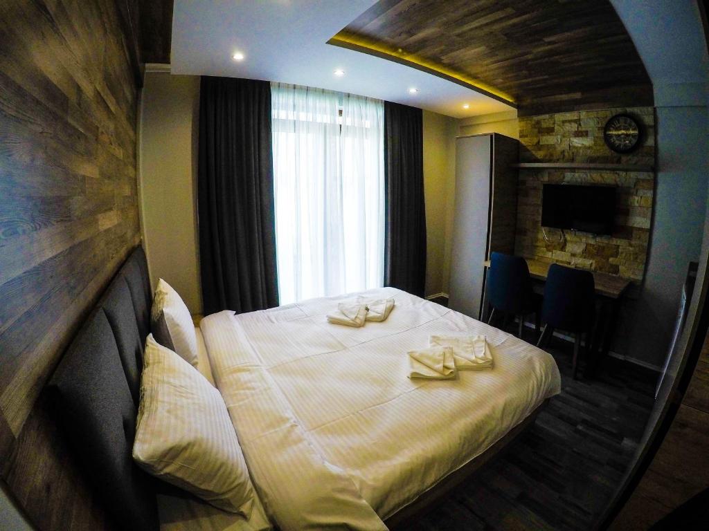 Postel nebo postele na pokoji v ubytování SM Apartments Kopaonik