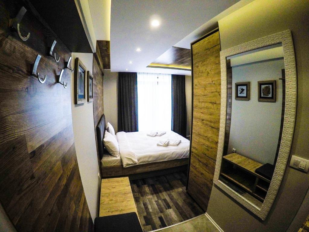 Postel nebo postele na pokoji v ubytování SM Apartments Kopaonik
