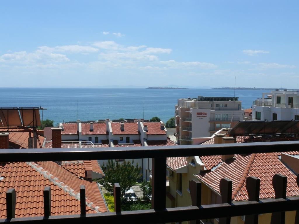 a view of the ocean from the roofs of buildings at Complex Kentavar - Free Fast WiFi in Sveti Vlas