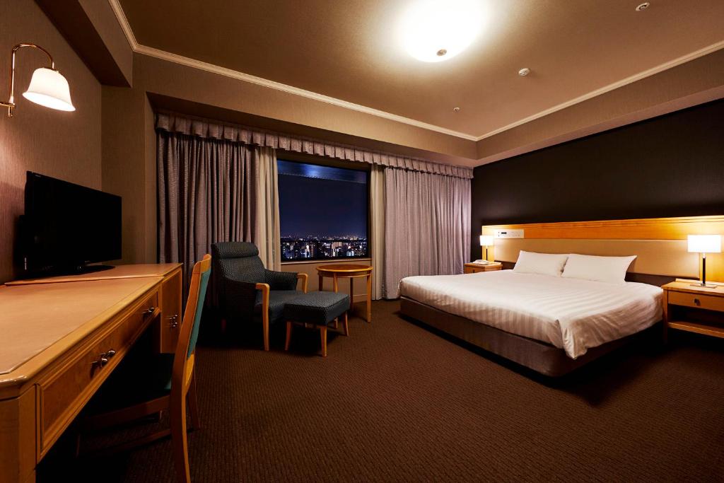 Postel nebo postele na pokoji v ubytování Hotel Agora Regency Osaka Sakai