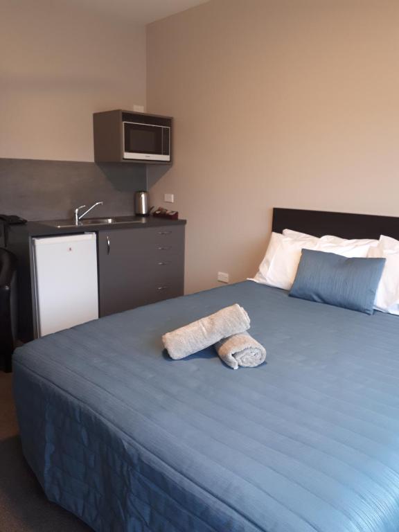 Postel nebo postele na pokoji v ubytování Northpark Motel