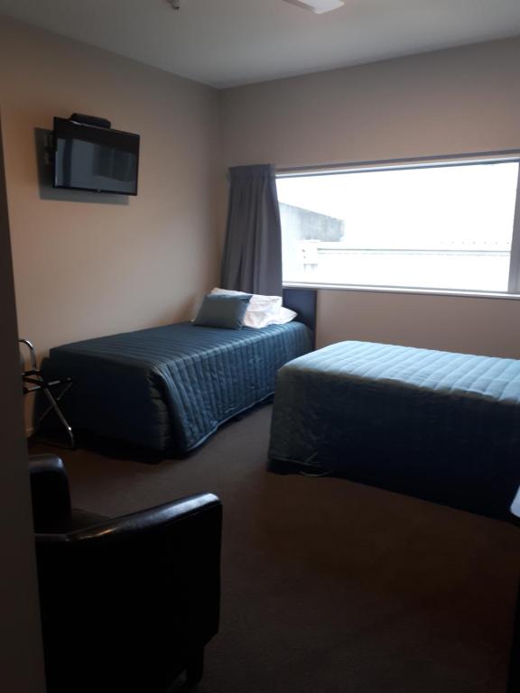Postel nebo postele na pokoji v ubytování Northpark Motel
