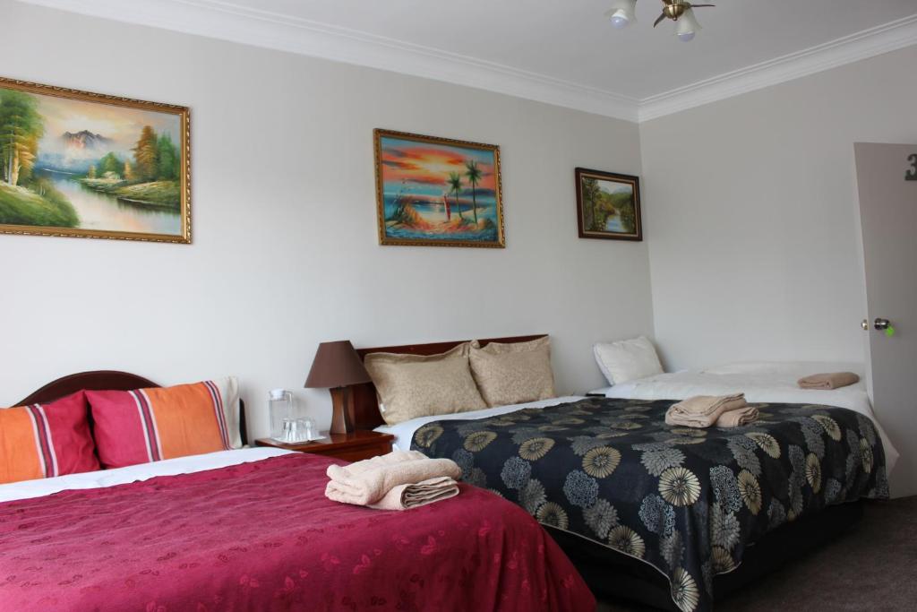 Postel nebo postele na pokoji v ubytování Mini Homestay