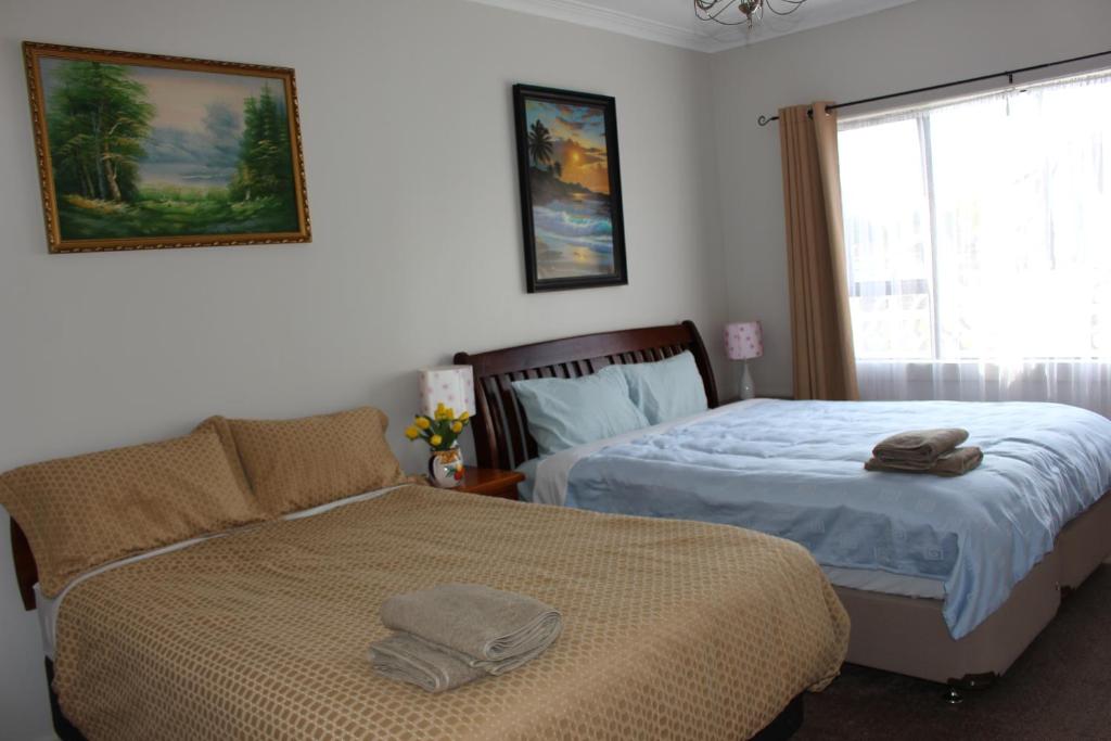 Postel nebo postele na pokoji v ubytování Mini Homestay
