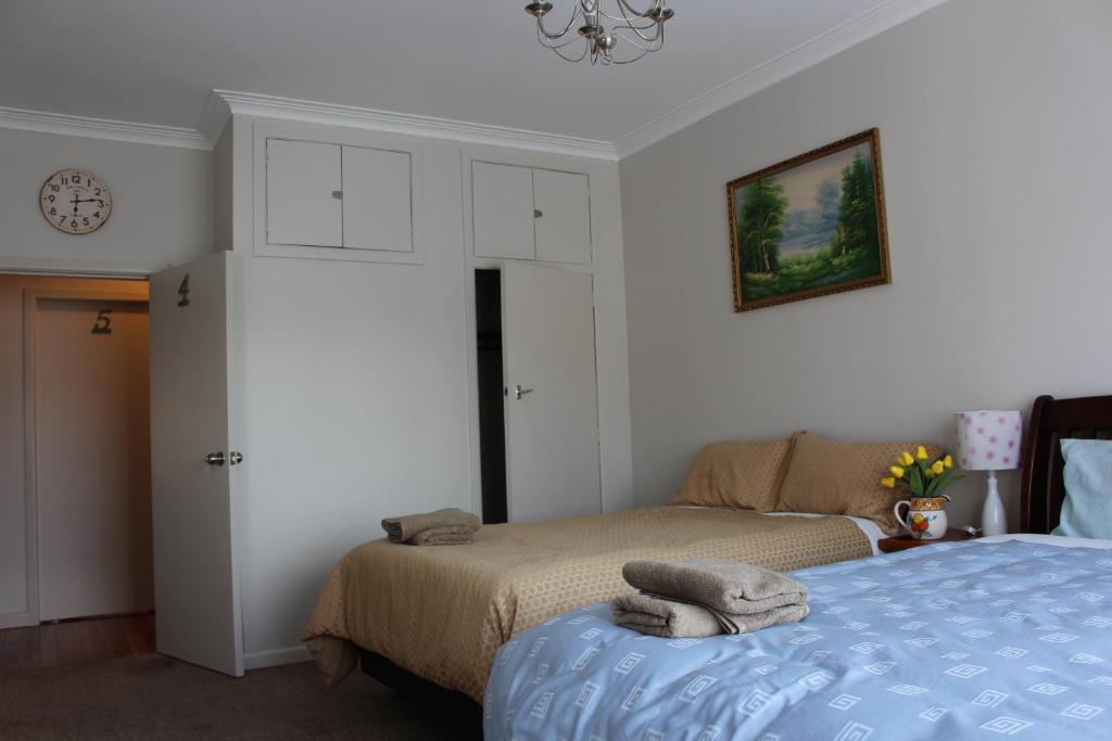 Postel nebo postele na pokoji v ubytování Mini Homestay