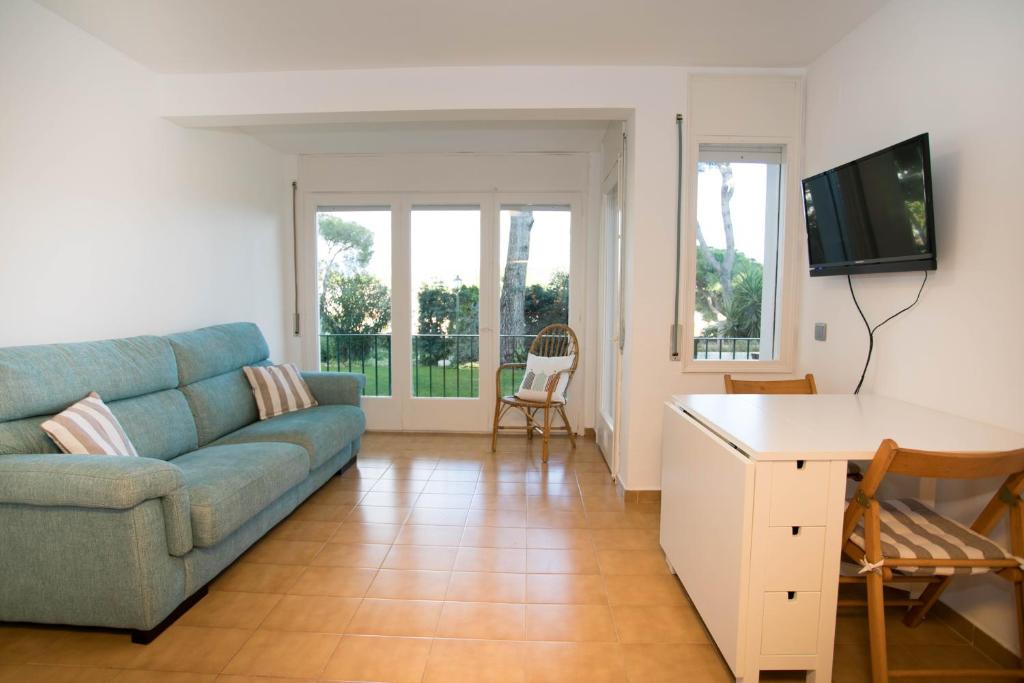 Televízia a/alebo spoločenská miestnosť v ubytovaní Espectacular apartamento en el corazón de Calella!