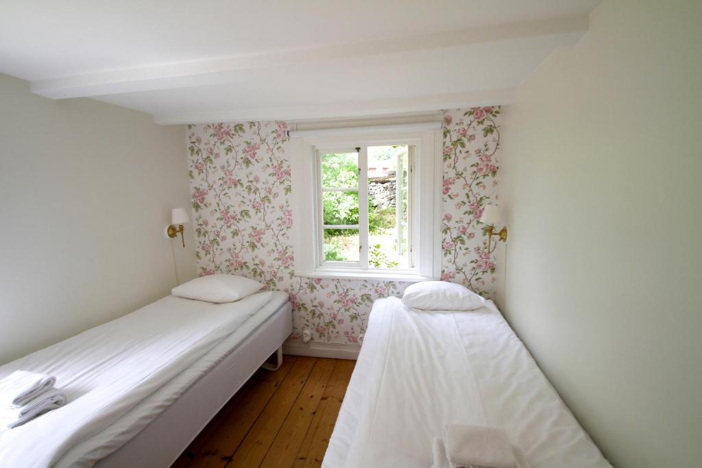 Postel nebo postele na pokoji v ubytování Tjärö Hotell & Vandrarhem