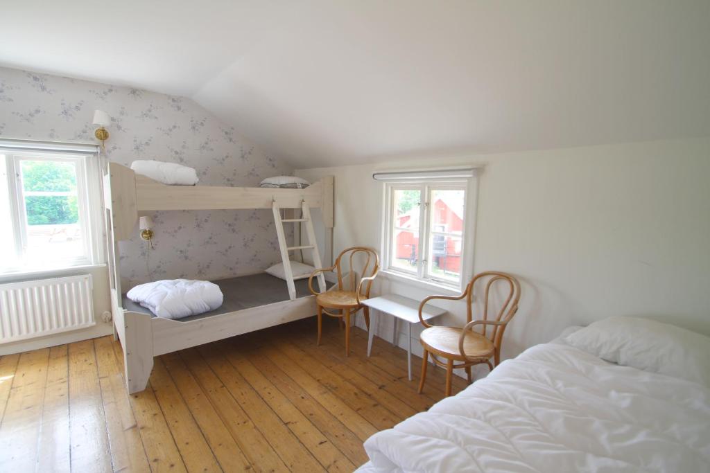 Postel nebo postele na pokoji v ubytování Tjärö Hotell & Vandrarhem